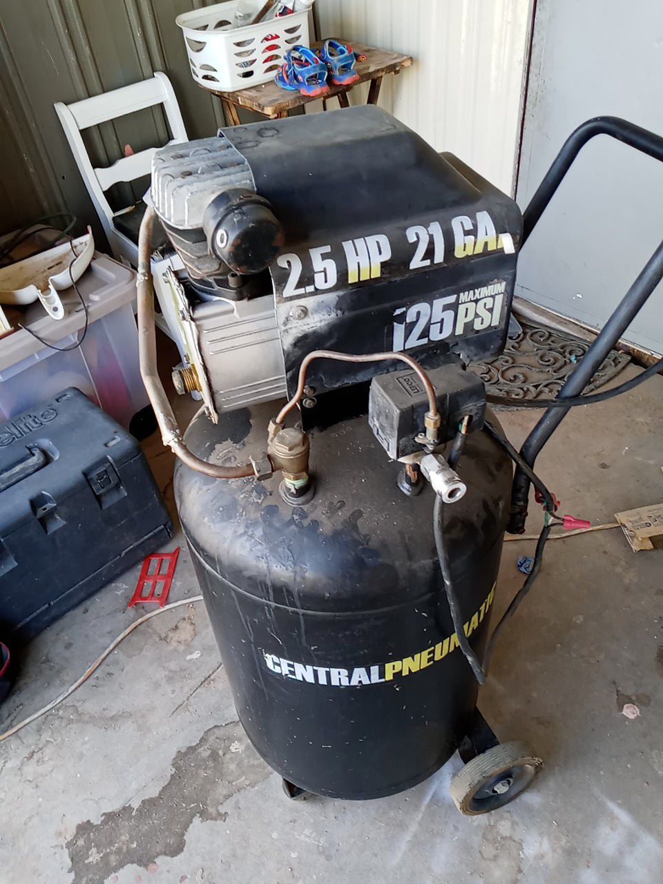 Centralpneumatic air compressor plus hand saw works good