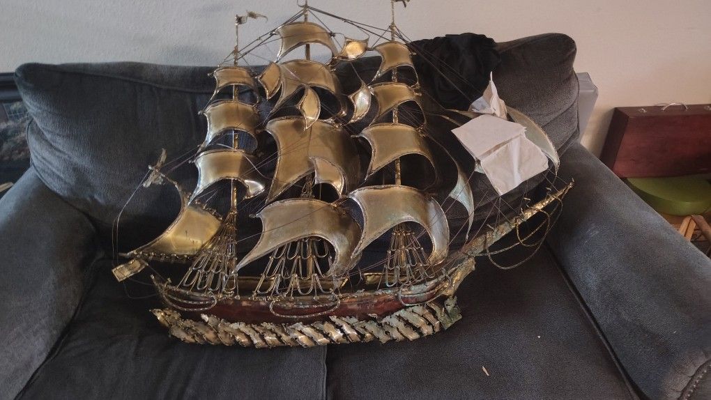 brass sculpture sail boat