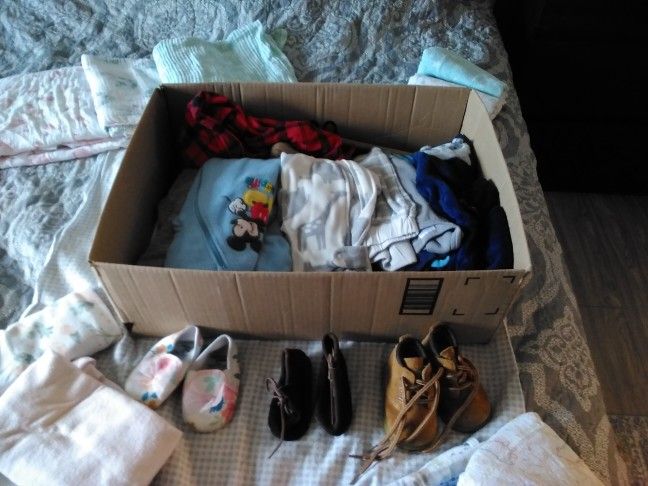Baby Clothes And Burp Cloths.