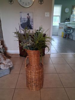 Tall basket with assorted greens.