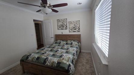 A queen size bed with firm mattress, a frame and a headboard