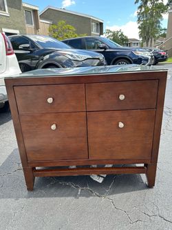 Beautiful wooden dresser with glass top
