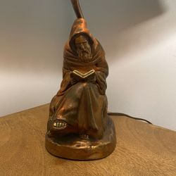 Antique armor bronze monk lamp with leather shade