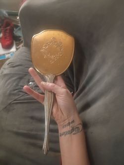 Vintage brass hand help mirror