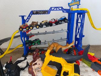 Monster Jam Garage Playset with extra toys included