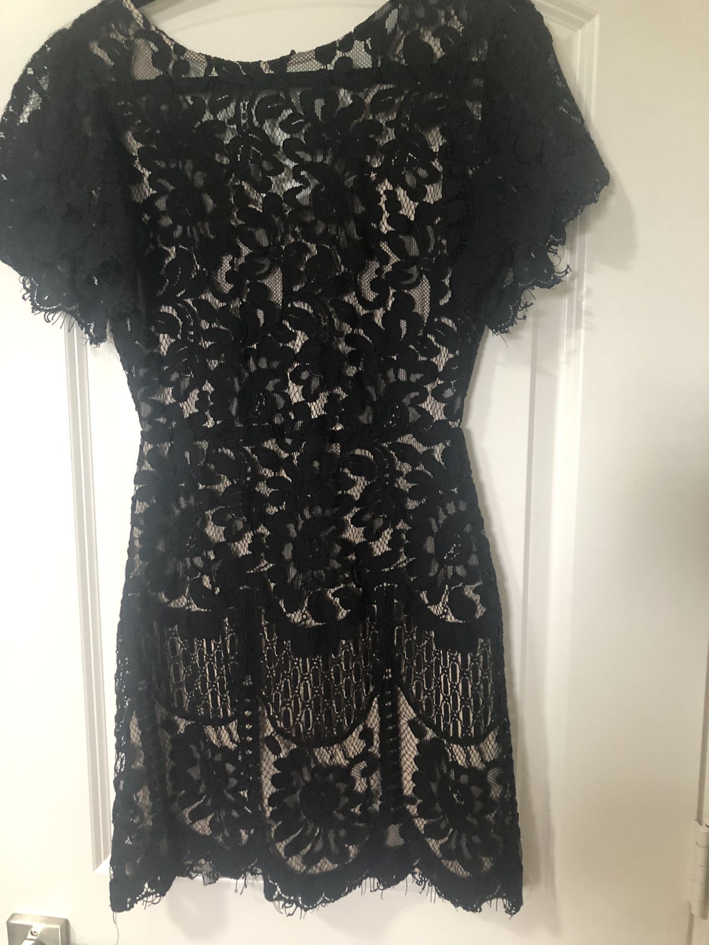 Black lace cocktail dress. Black lace with nude underlay.