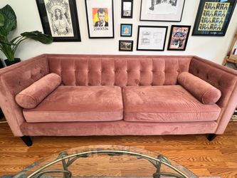 Pink velvet tufted sofa