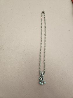 TURQUOISE & STERLING SILVER SQUASH BLOSSOM NECKLACE WITH FLORAL PENDANT. 