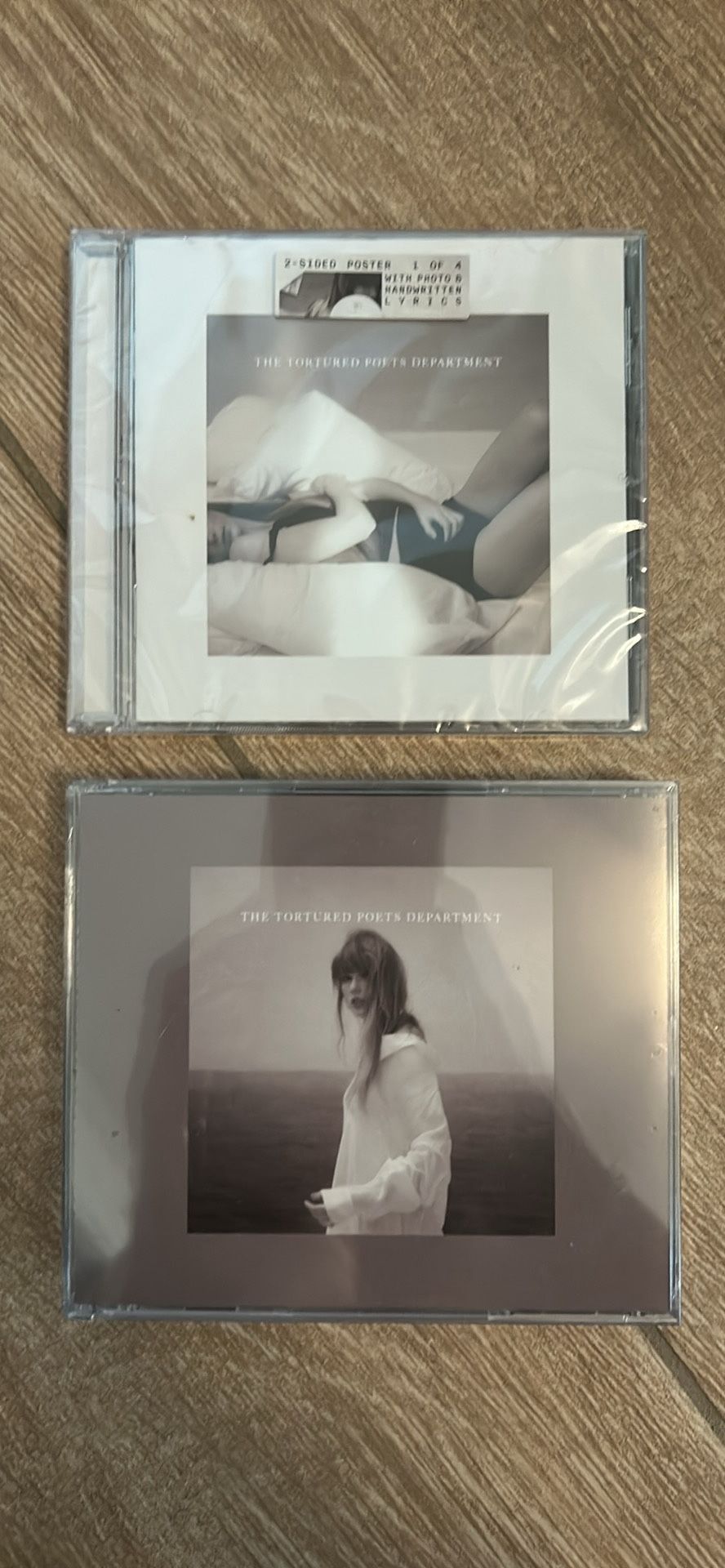 Taylor Swift, tortured poets department, CDs. The manuscript edition and the albatross edition with bonus items.