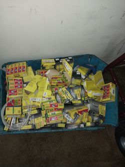 Large box of spark plugs mostly new old stock