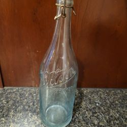 Wilson Rockford IL 12" tall vintage clear bottle