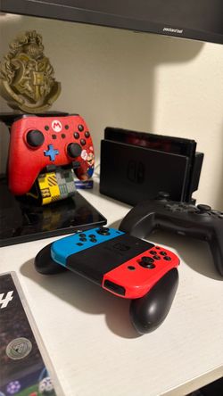 Nintendo switch oled, Mario kart wheel with accelerator and brake estar controllers