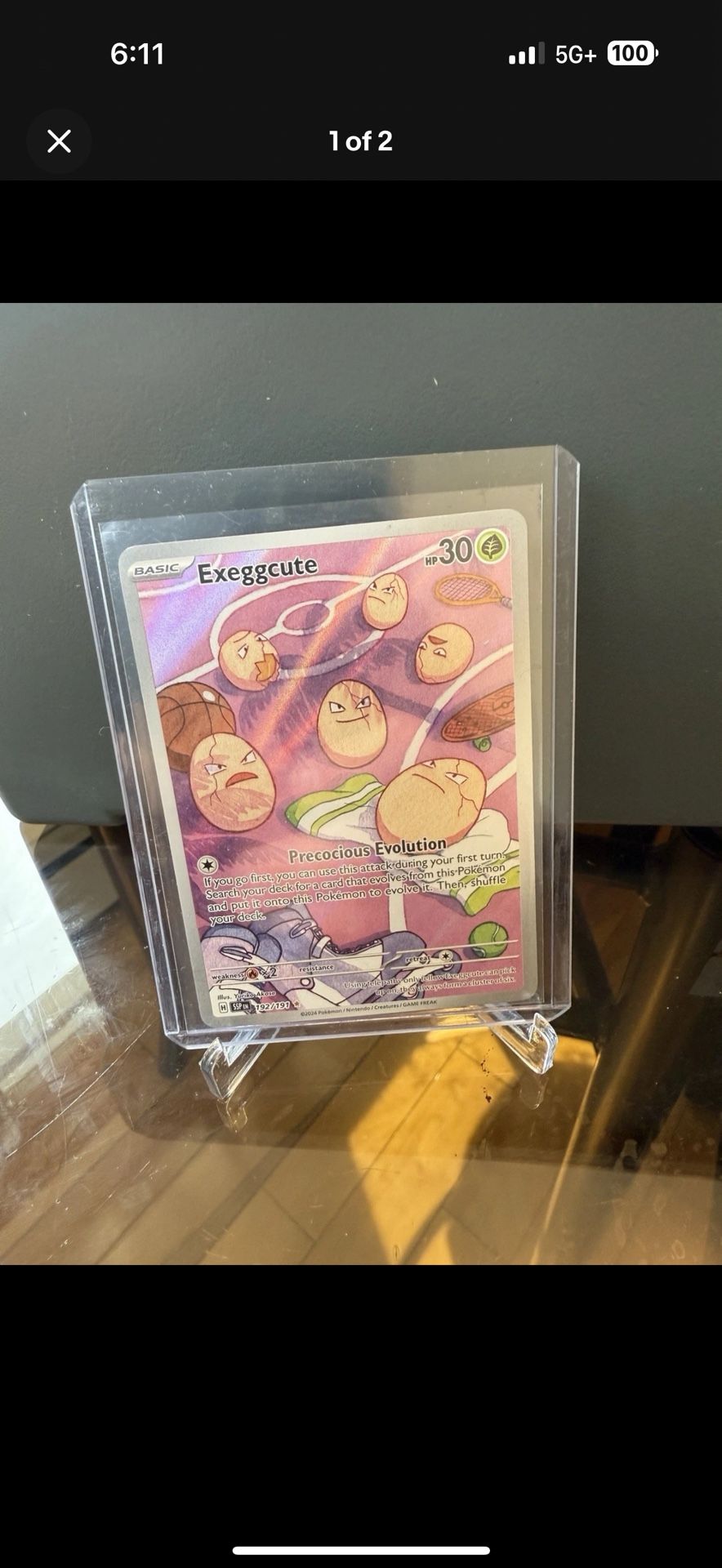 Exeggcute 192/191 Sv08: Surging Sparks Holo Pokémon