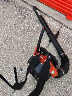 This is an ECHO PB-580H or PB-770 backpack blower, recognizable by its distinct orange housing and black nozzle.