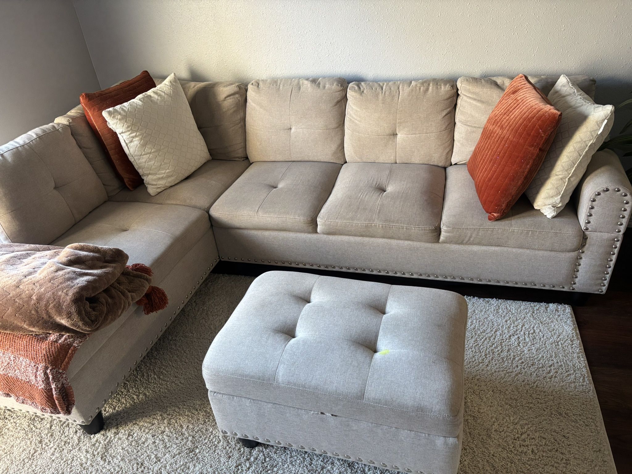 Beige sofa and ottoman