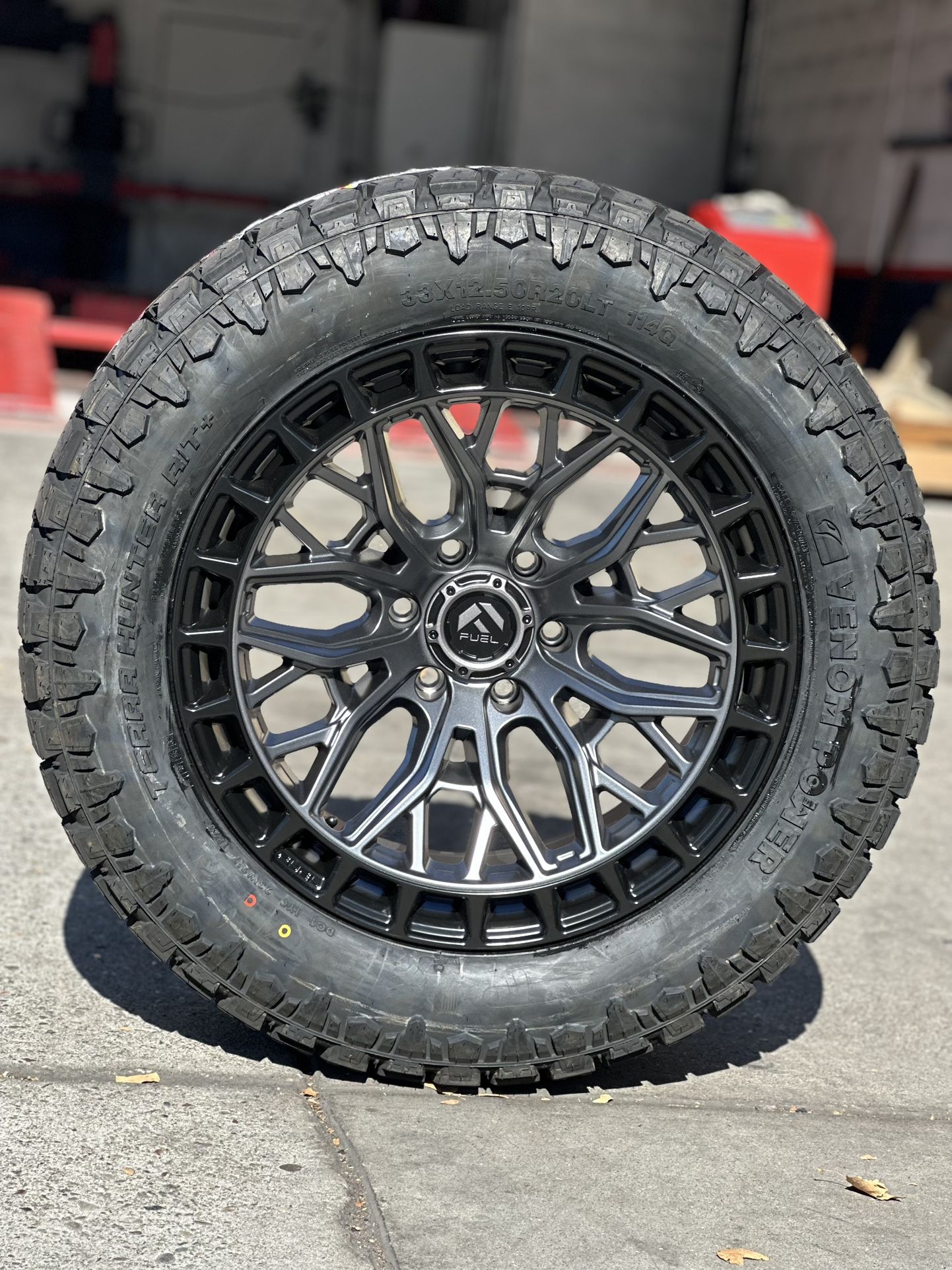 Fuel sigma 20x10 6x139.7 with 33x12.50r20 venom R/T tires 10plys available we finance