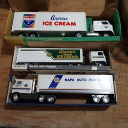 Three Collectible Metal Tractor Trailers
