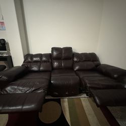 Ashley leather sofa burgundy color. see pictures closer some wear & tears.