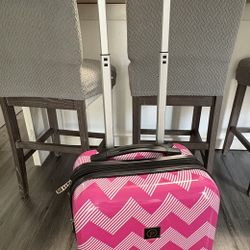 Pink Hardcover Suitcase On Wheels. It measures