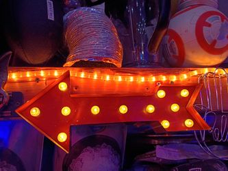 Seahawks lighted arrow and red arrow lighted signs