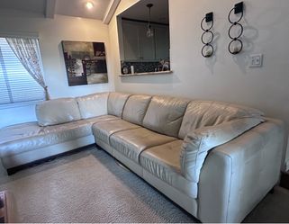 Cream Leather Sectional with matching ottoman