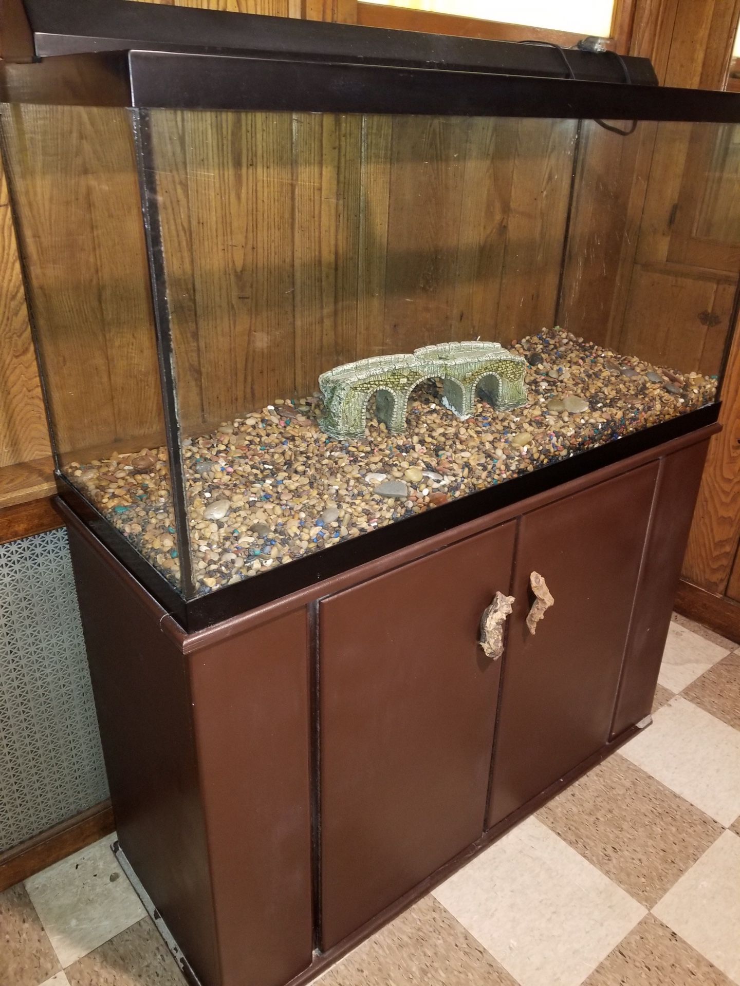 90 gallon tank and stand completed with lights and filters .