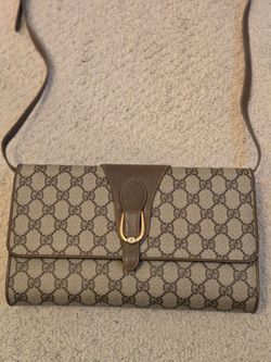 Gucci vintage Supreme GG clutch handbag with removable strap. Original tag and serial number intact.