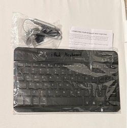 iPad keyboard and in ear headphones