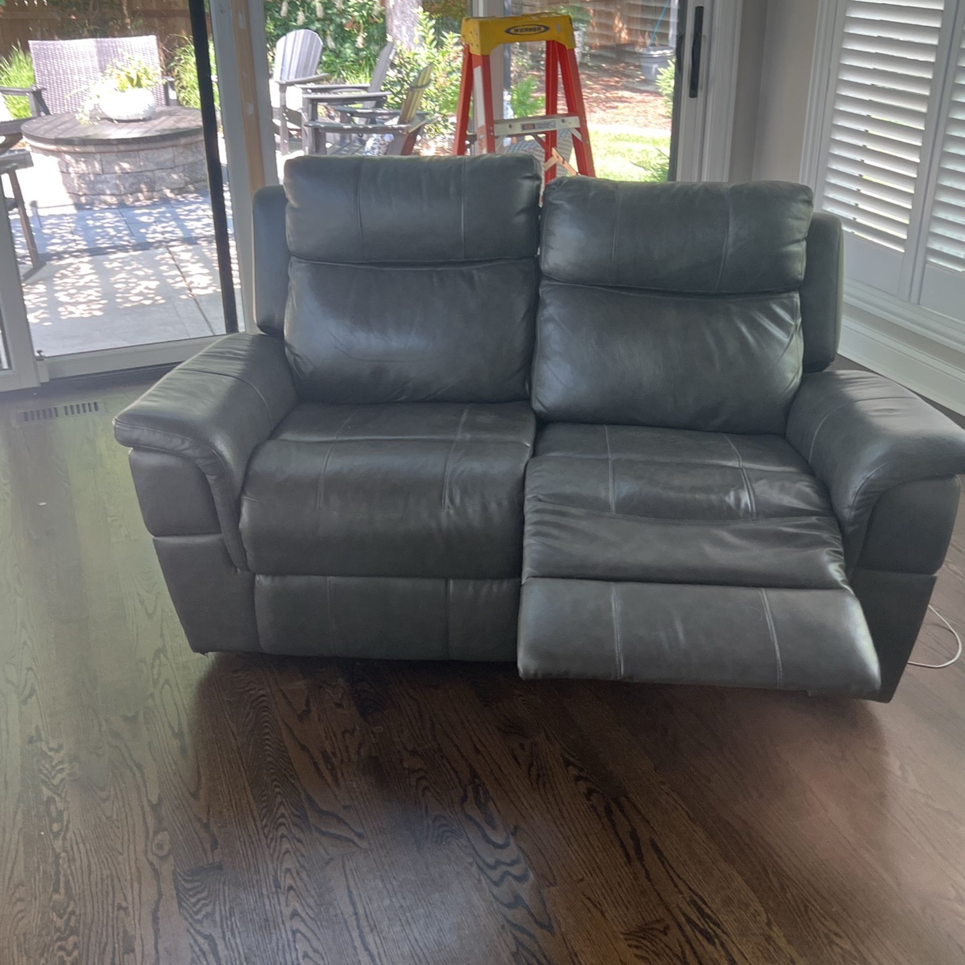 Dual reclining electrical leather loveseat