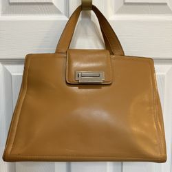 Adrienne Vittadini camel leather top handle bag with silver hardware.