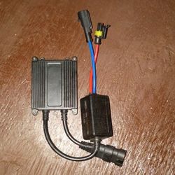 DDM Tuning 35W or 55W slim digital HID ballast, which is a component of a High Intensity Discharge (HID) headlight conversion kit. 