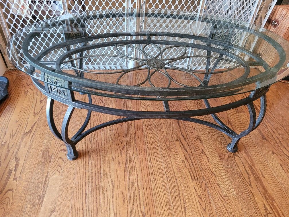 Wrought iron with glass top oval coffee table