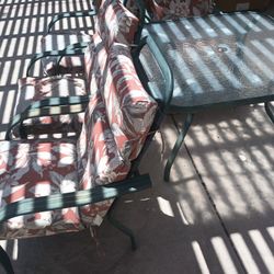 Free Patio Set. 4 Chairs And A Glass Table. Need Painting And New Cushions. 