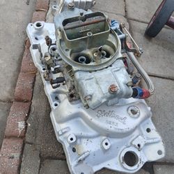 EDELBROCK ALUMINUM INTAKE  WITH HOLLEY DOUBLE PUMP!!FOR SB CHEVY !!! 225 $ OBO ....TRADE?