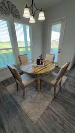 Full table with chairs and rug