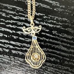16k chain and gold pendant with possible diamond