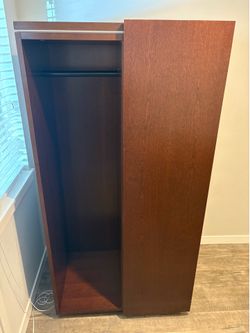 Sliding door storage cabinet