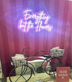Neon sign - “everything but the flowers”