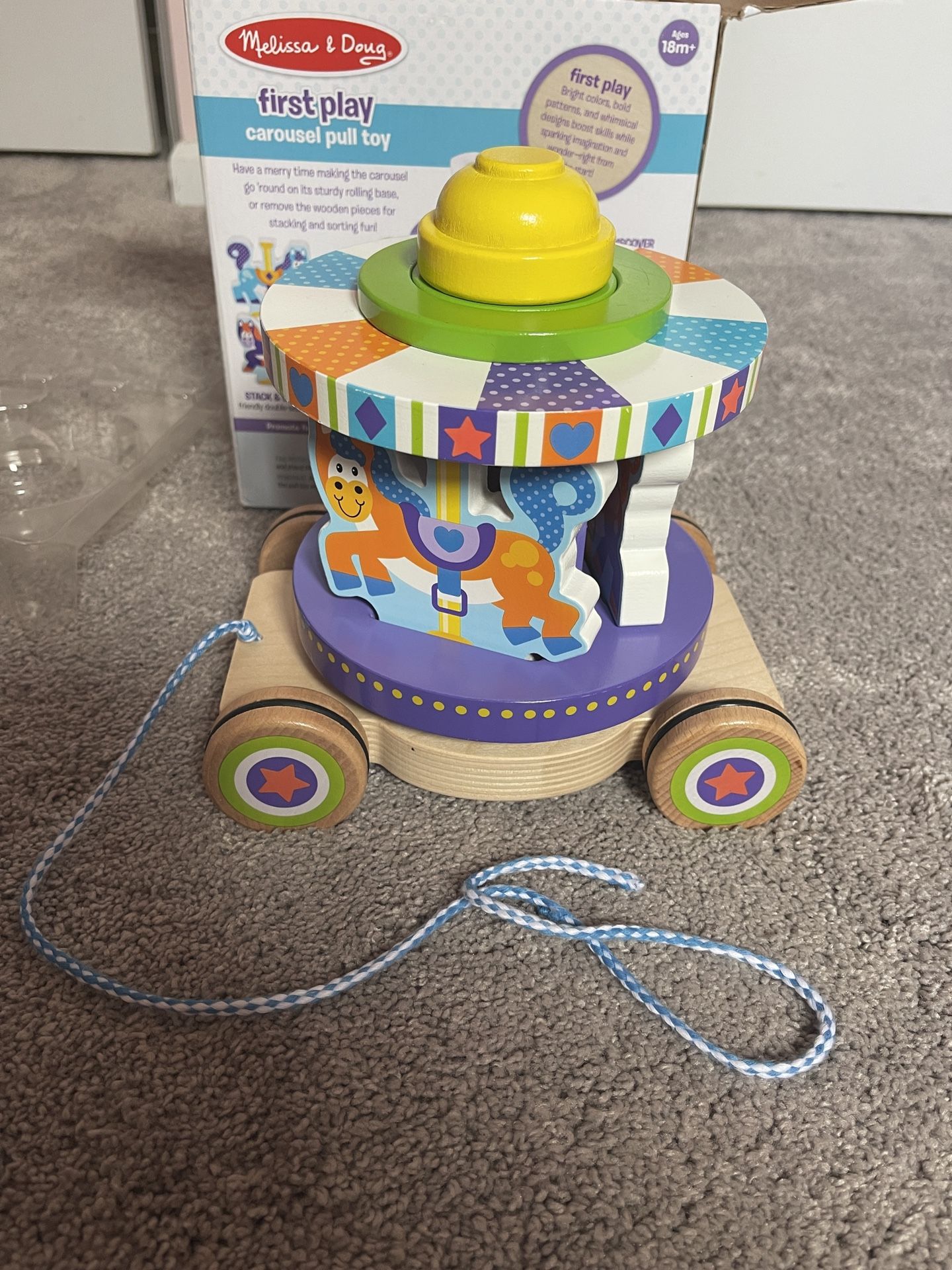 Melissa and doug carousel pull best sale toy