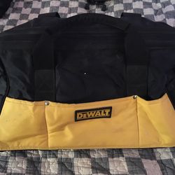 DEWALT-TOOL BAG,HEAVY DUTY, WATER-RESISTANT NYLON STORAGE WITH MULTIPLE POCKETS $15