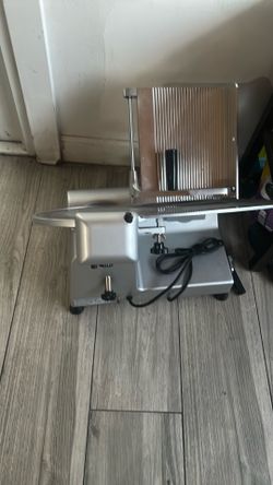 This is a commercial-grade electric meat slicer