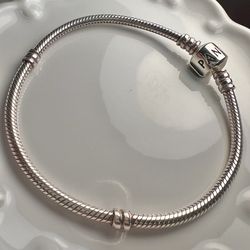 PANDORA Sterling Silver charm bracelet (bracelet only) 7.5”