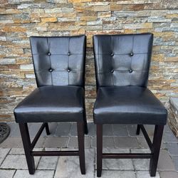 2 black leather stools