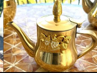 Gold Teapot with Decorative Design
