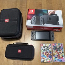 Nintendo Switch + 2 Cases + Mario Kart 8 + Super Mario Party