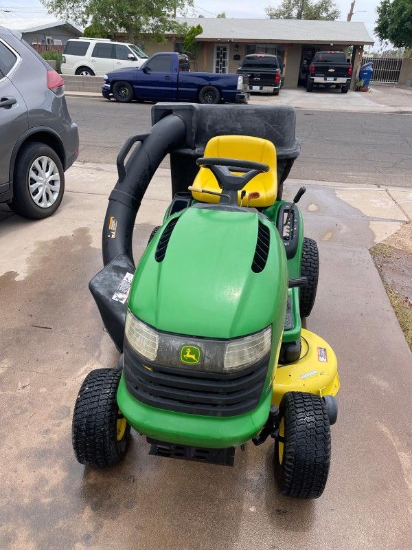 John Deere riding lawn mower
