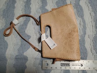 The Sak tooled leather floral pattern purse