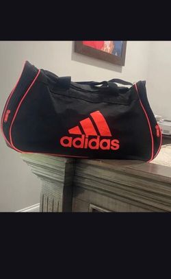 Adidas Black Duffel Bag with Vibrant Coral Highlights