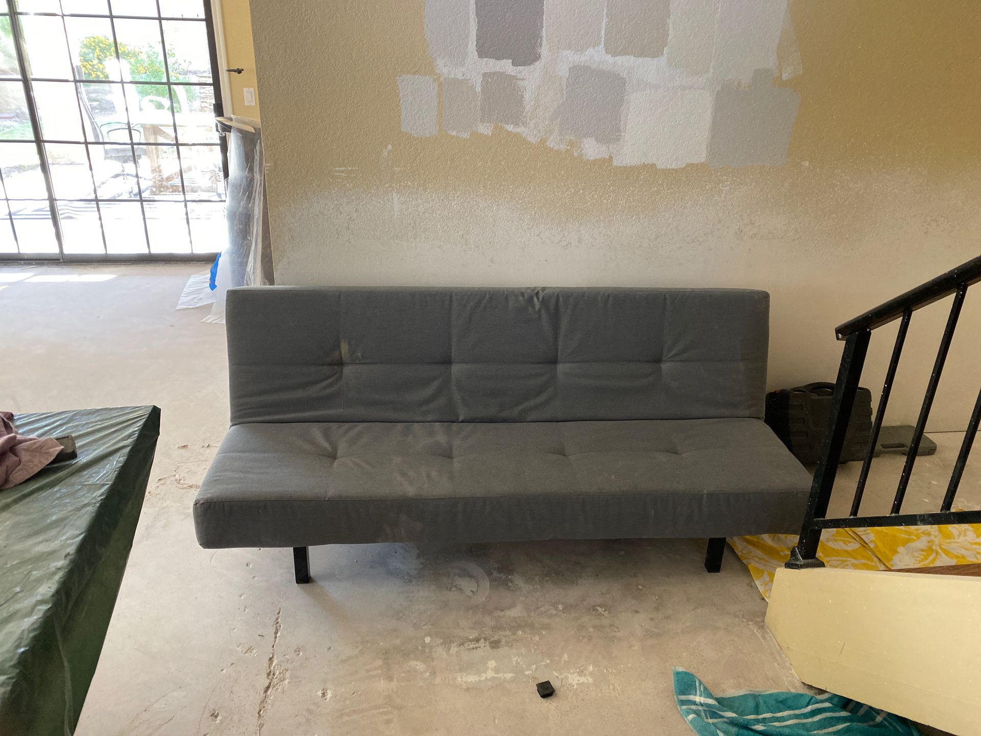 Gray futon. Perfect working condition. About two years old. Wife is remodeling and my stuff has to go!