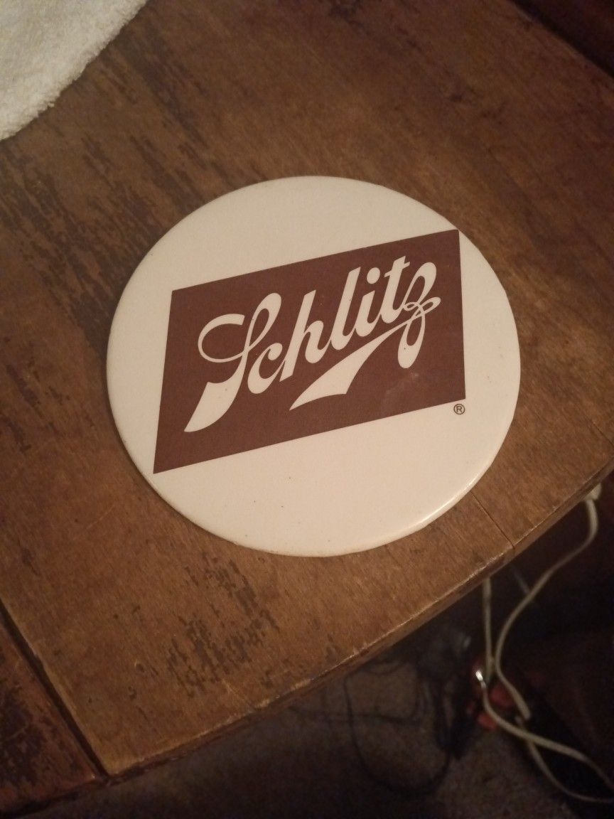 Vintage 4 Inch Schlitz Button Great Condition.
